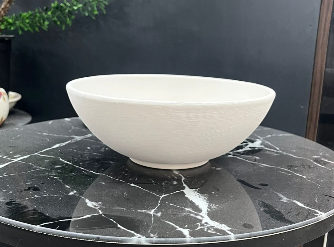 White Bisque bowl on a black marble table